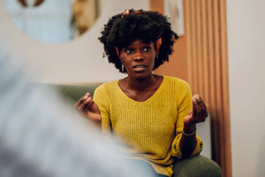a woman opens up in a bipolar disorder therapy program