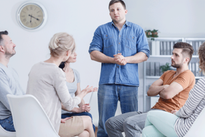 participants in a residential treatment program meet for a group therapy session
