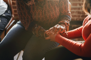 a woman receives mutual support in a relapse prevention therapy program