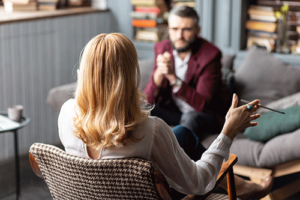 an addiction therapist gives a client guidance during a session
