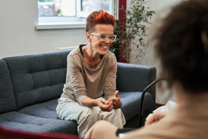 a woman opens up to her trauma therapy counselor 